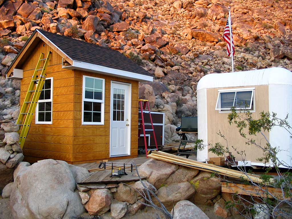 View of the shed, deck and trailers from the wash