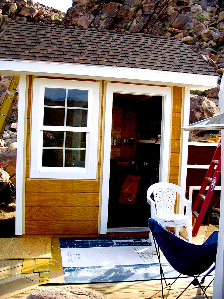 The window trim is on and taped for the top coat