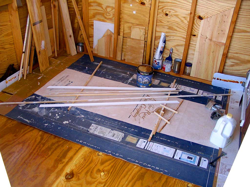 Priming the cove moulding to 'finish' the soffits