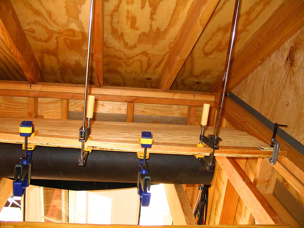 Glueing, screwing & clamping hinge board to wall-to-be