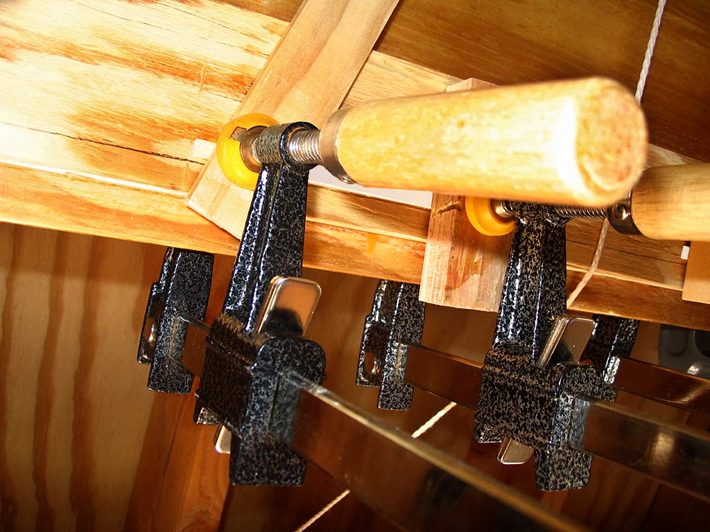 Glueing thin strips of wood to widen the sliding door track a bit